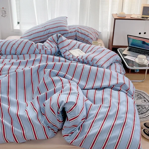 Simple Red and Blue Striped Duvet Cover and Four Piece Bed Sheet Set with Washed Cotton Bedding on the Bed - Image 5