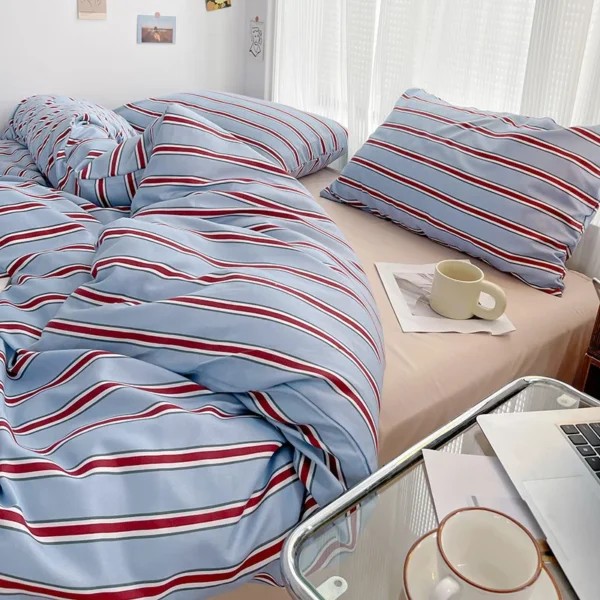 Simple Red and Blue Striped Duvet Cover and Four Piece Bed Sheet Set with Washed Cotton Bedding on the Bed - Image 4