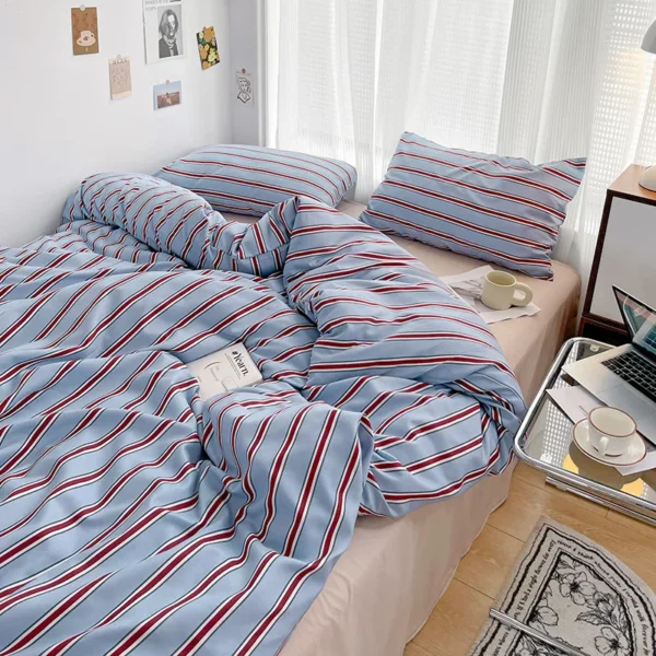 Simple Red and Blue Striped Duvet Cover and Four Piece Bed Sheet Set with Washed Cotton Bedding on the Bed - Image 3
